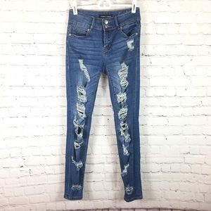 Almost famous blue Jean distressed jeggin’s size 1